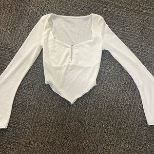 Long sleeve white top.